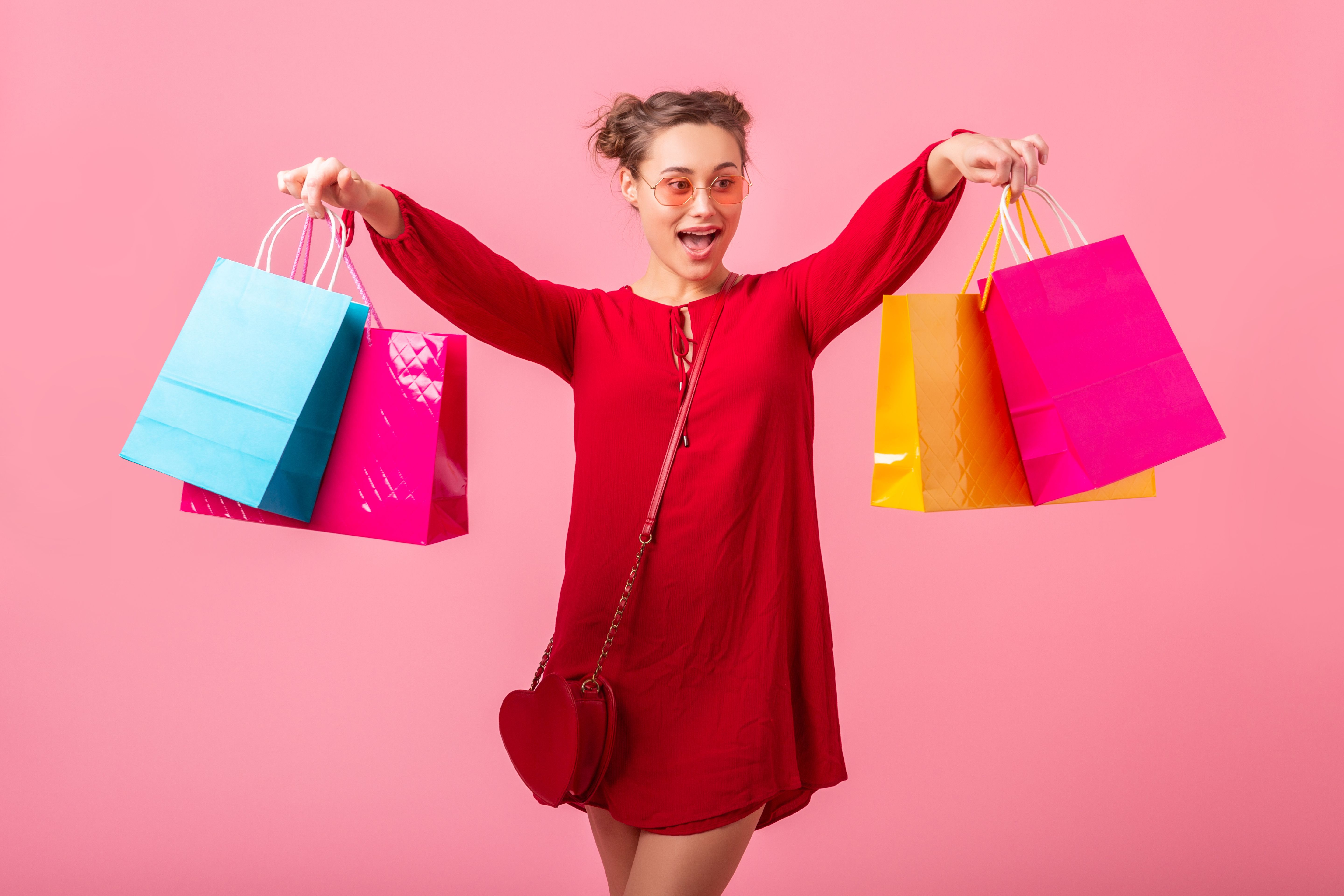 attractive-happy-funny-emotion-stylish-woman-shopaholic-red-trendy-dress-holding-colorful-shopping-bags-pink-wall-isolated-sale-excited-spring-summer-fashion-trend.jpg
