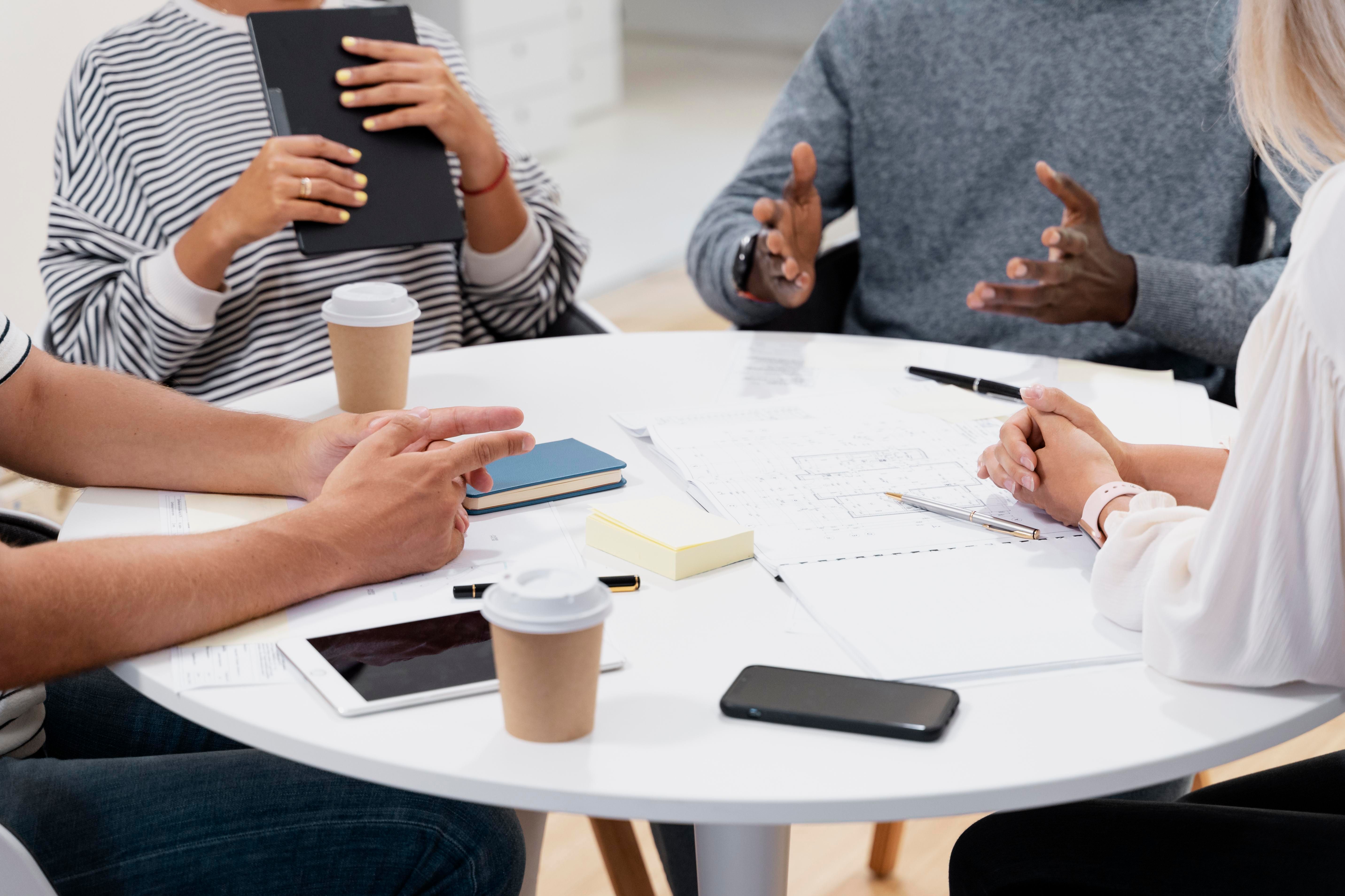 close-up-young-colleagues-having-meeting.jpg