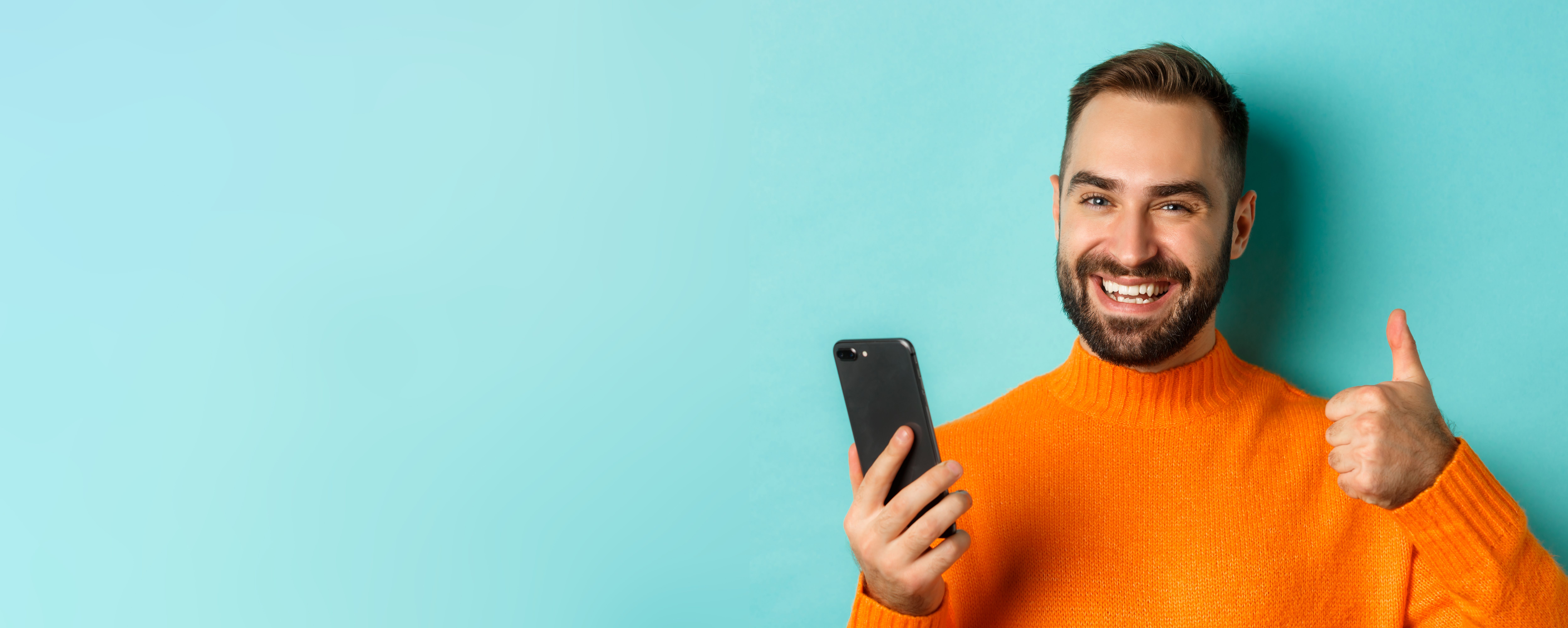 closeup-bearded-man-holding-smartphone-thumbs-up-recommending-mobile-app-standing-satisfied.jpg