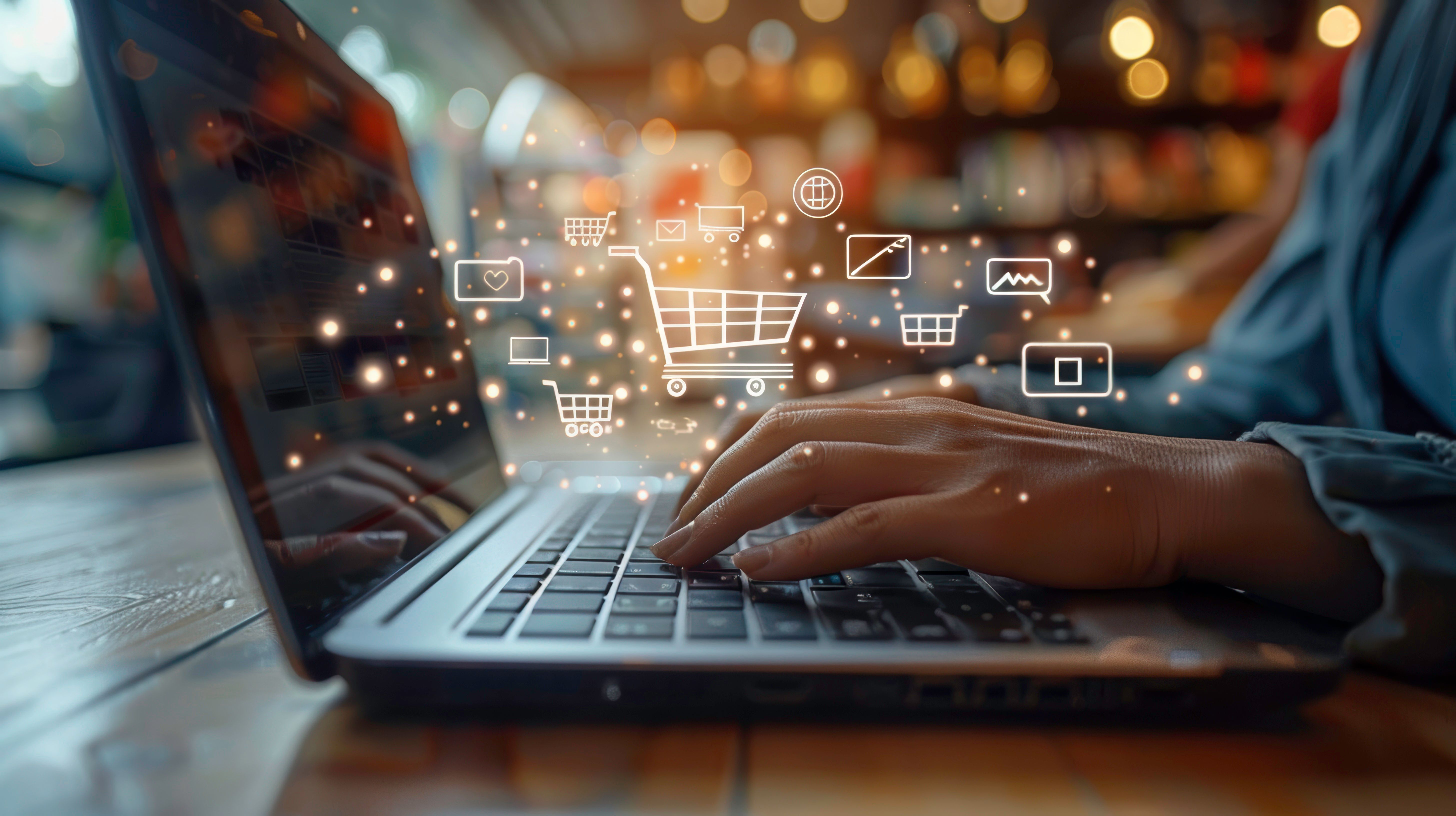closeup-hands-typing-laptop-with-digital-shopping-icons-symbolizing-online-retail-ecom.jpg
