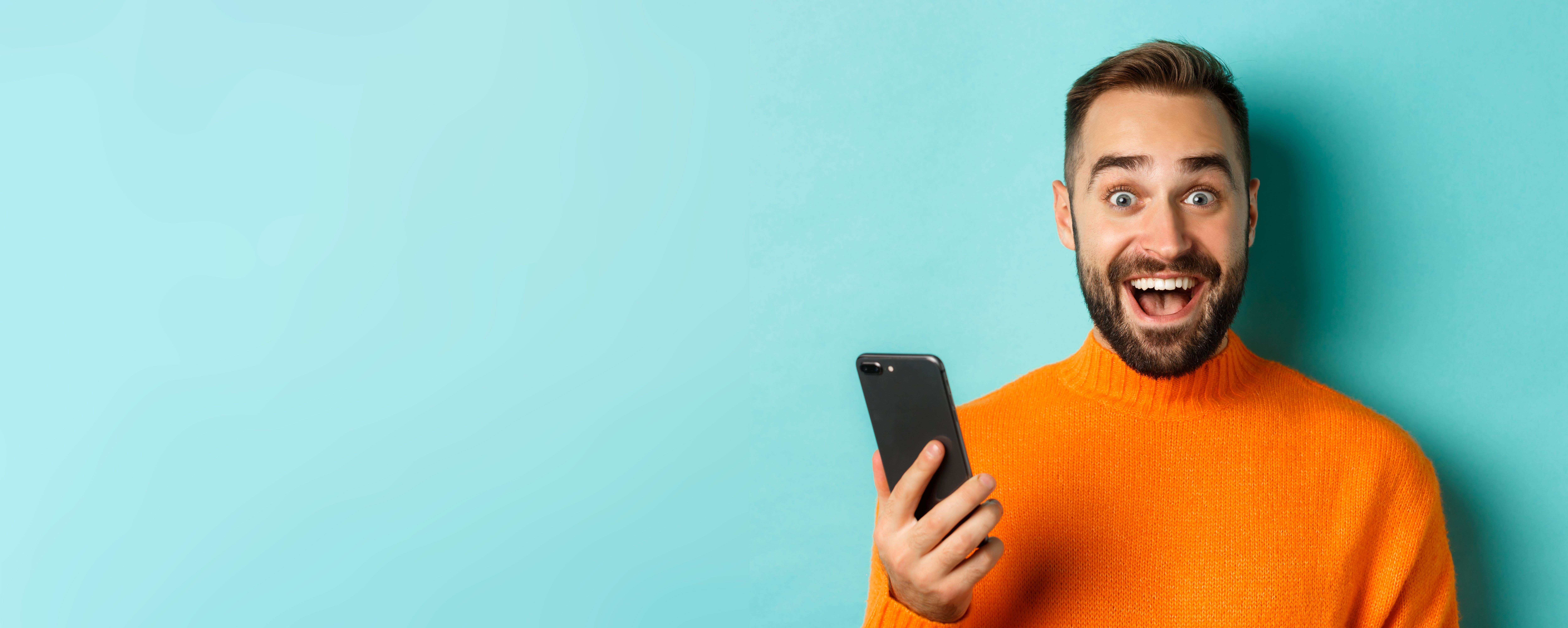closeup-happy-handsome-man-writing-message-mobile-phone-holding-smartphone-smiling-standin.jpg
