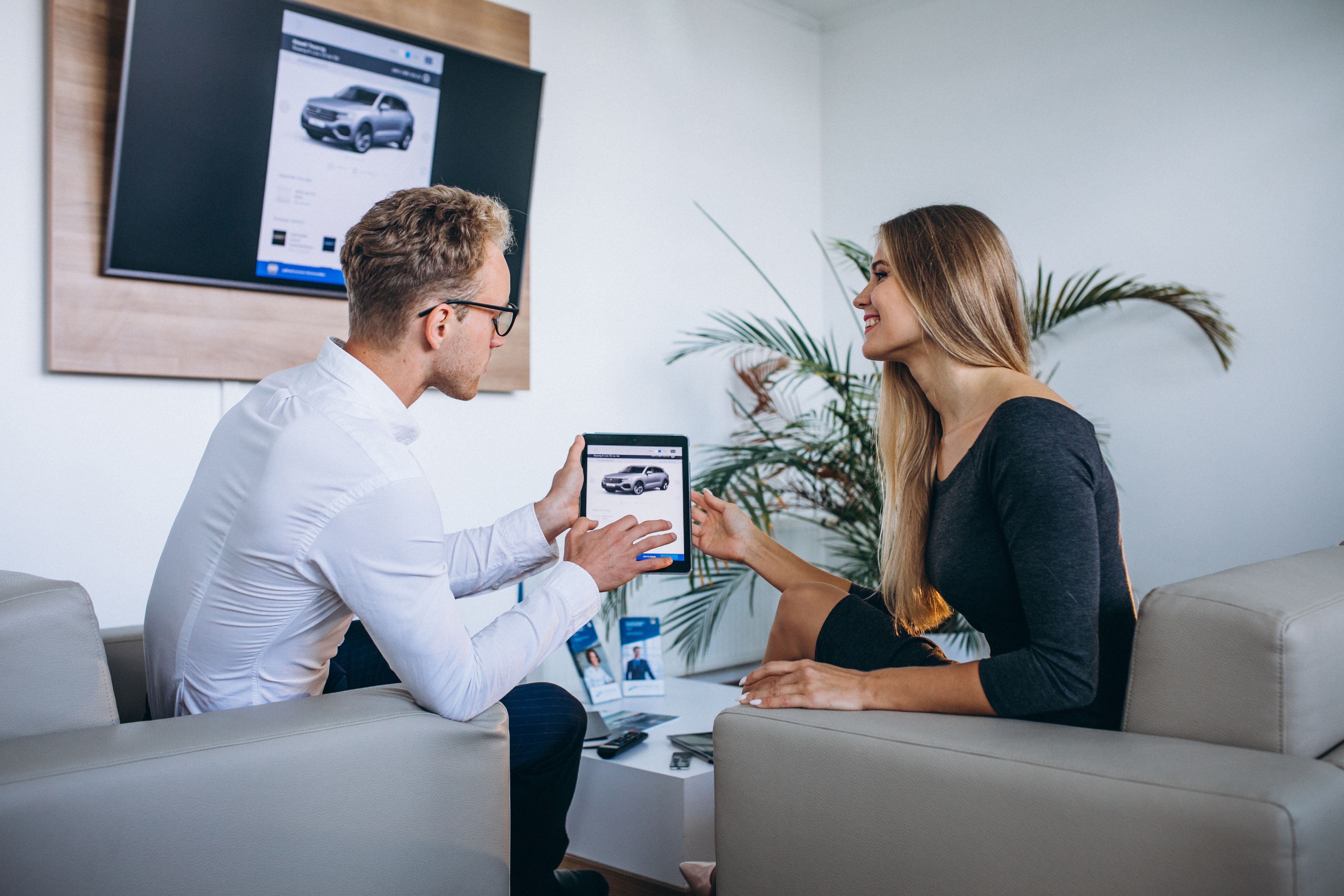 man-woman-car-showroom-using-tablet.jpg
