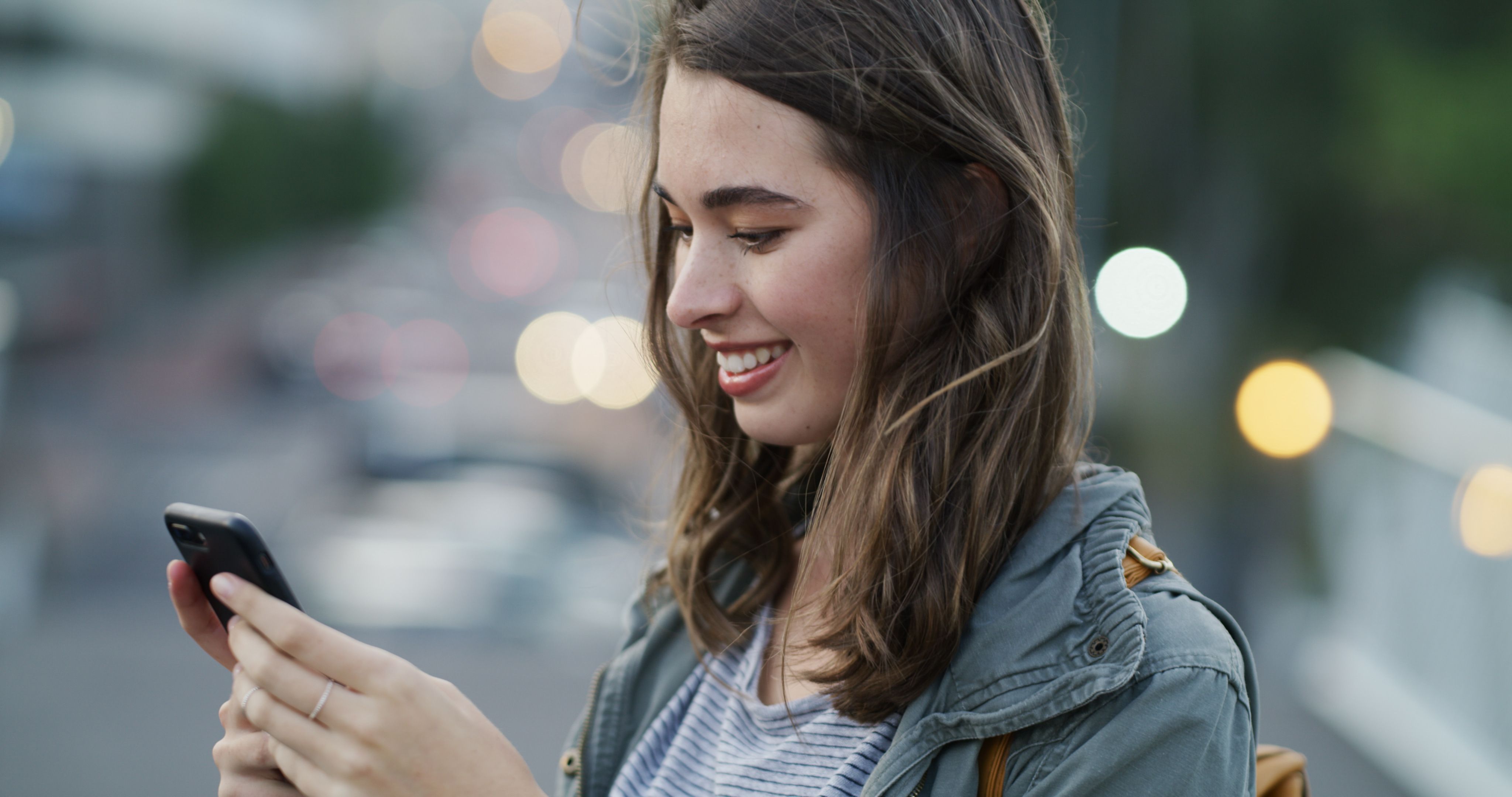 smile-woman-typing-with-phone-city-direction-search-online-navigation-social-media-bokeh-happy-tourist-smartphone-outdoor-urban-town-map-networking-explore-location-space.jpg