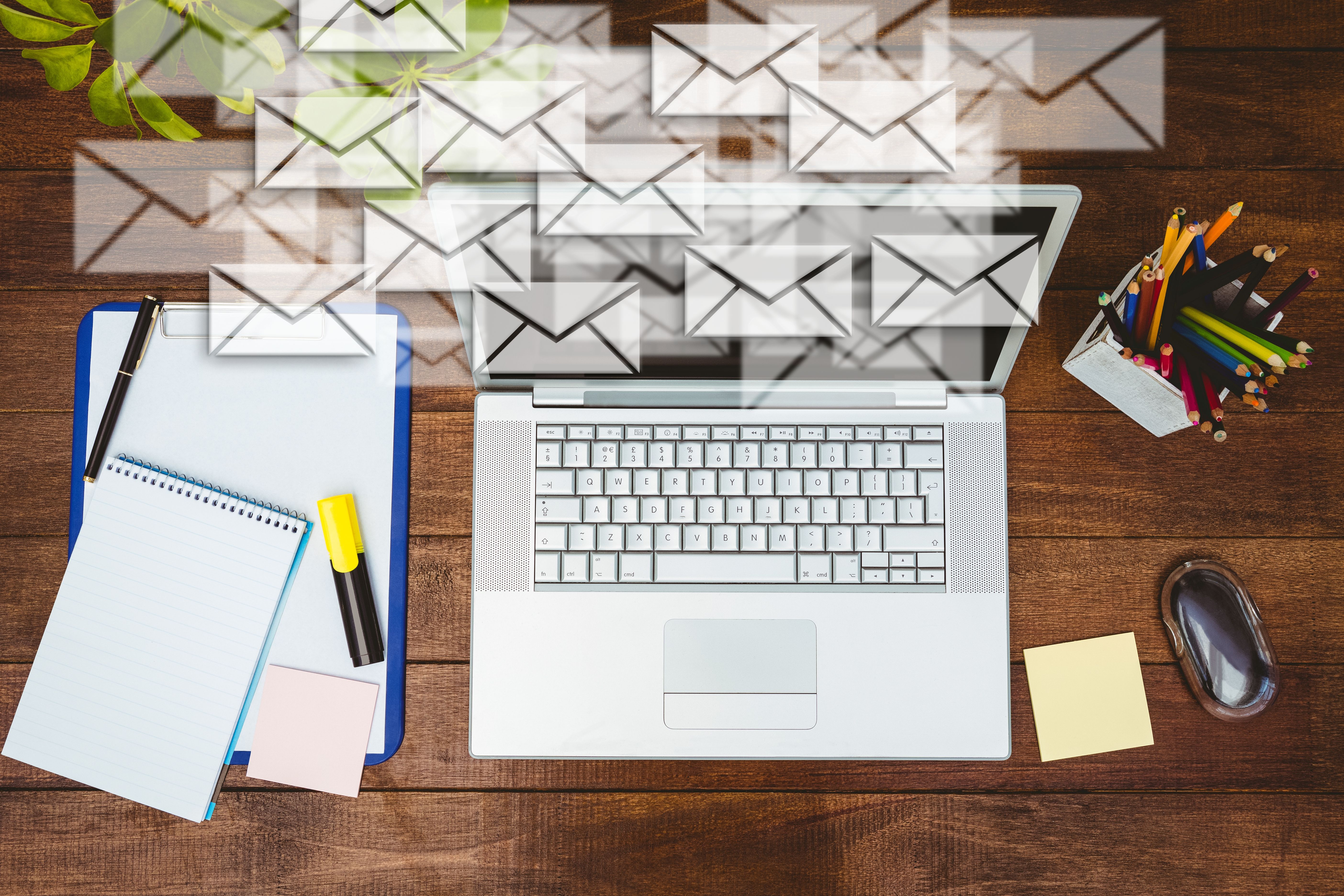workdesk-with-envelopes-laptop.jpg