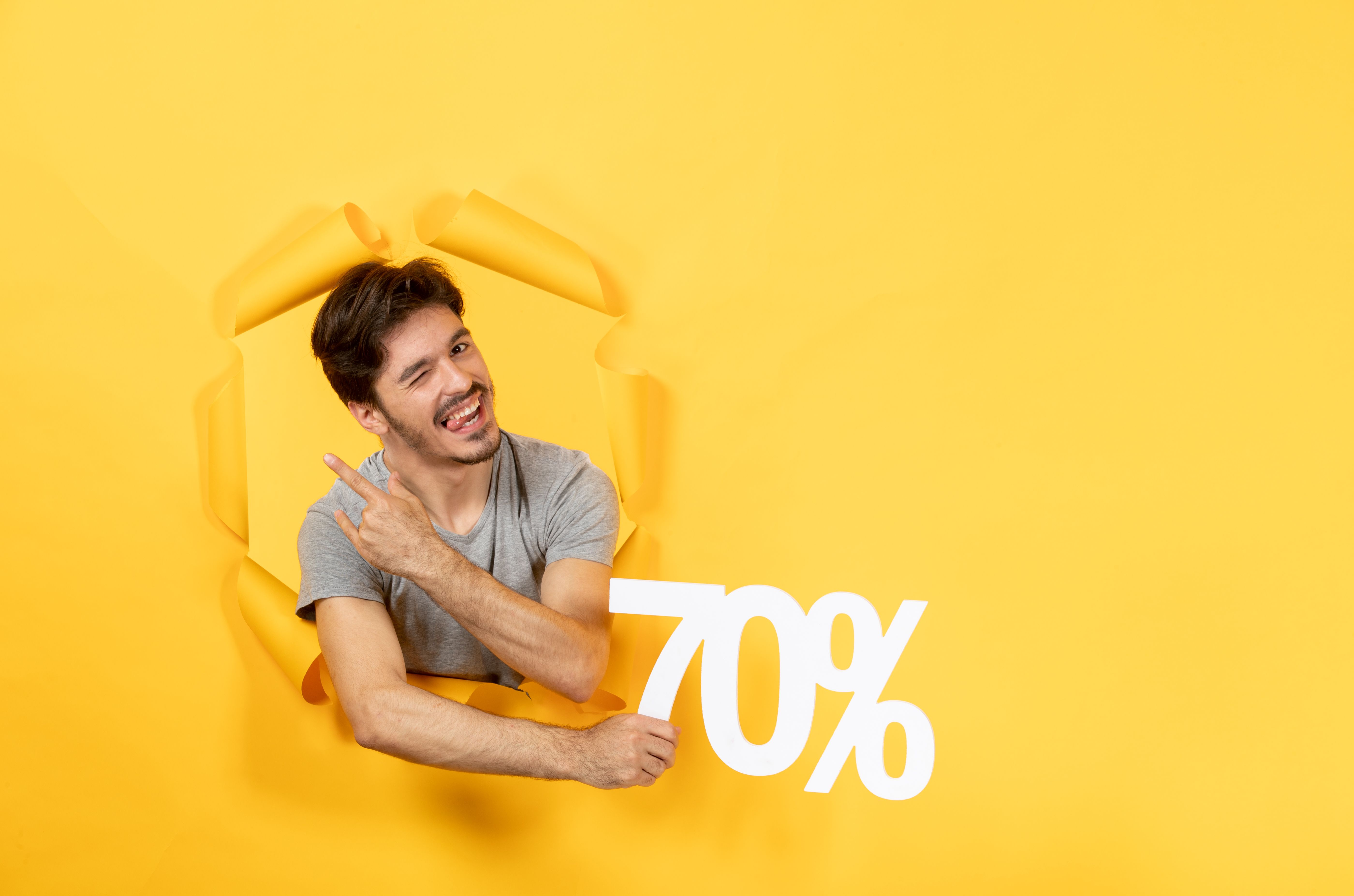 young-male-with-inscription-sign-torn-yellow-paper-background-shopping-guy.jpg